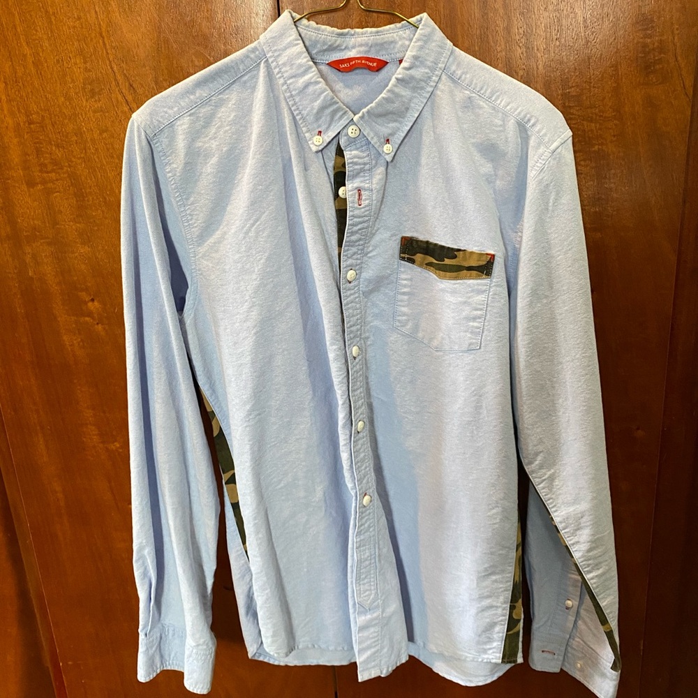 Saks Fifth Avenue Men’s Light blue button down long sleeve shirt with camo.